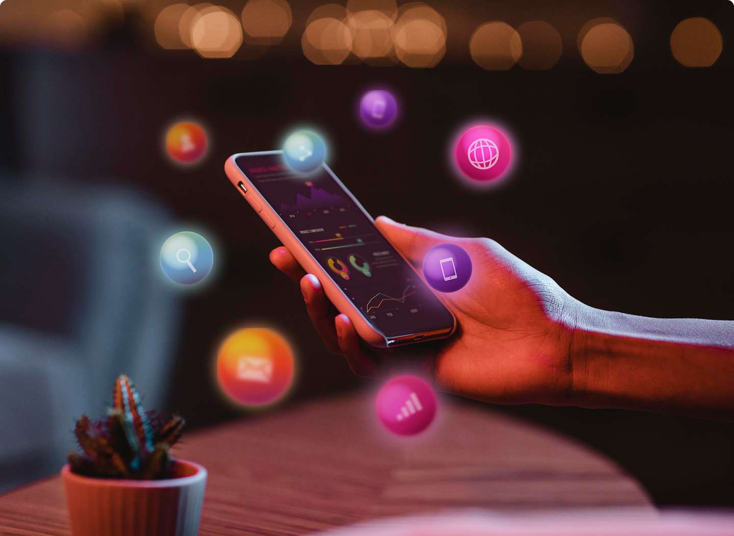 A person using a smartphone with floating social media icons representing online promotion and digital marketing services.