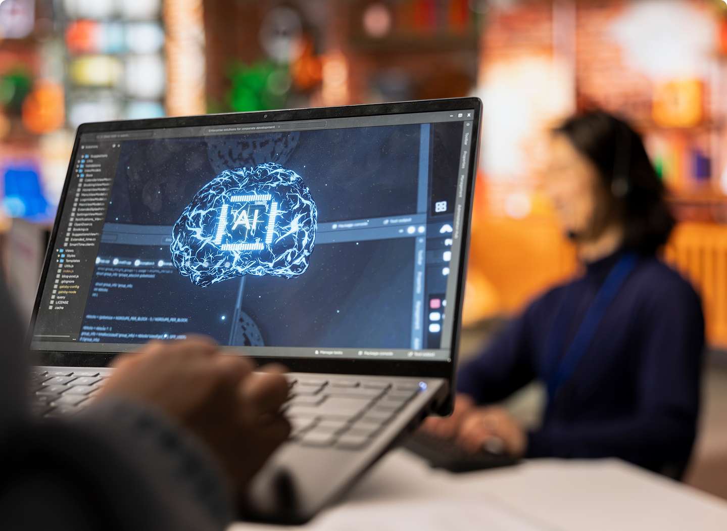 A professional working on a laptop displaying an artificial intelligence interface, symbolizing advanced data analysis and automation — representing machine learning development services for innovative business solutions.