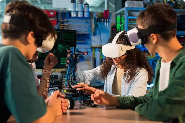 Team of developers collaborating with VR and electronic devices, representing innovation in web and software development and machine learning services.