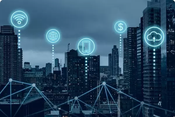 City skyline with connected digital icons and network lines, representing the Internet of Things (IoT).